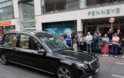 Penney’s Staff Form Guard of Honor as Founder’s Hearse Passes